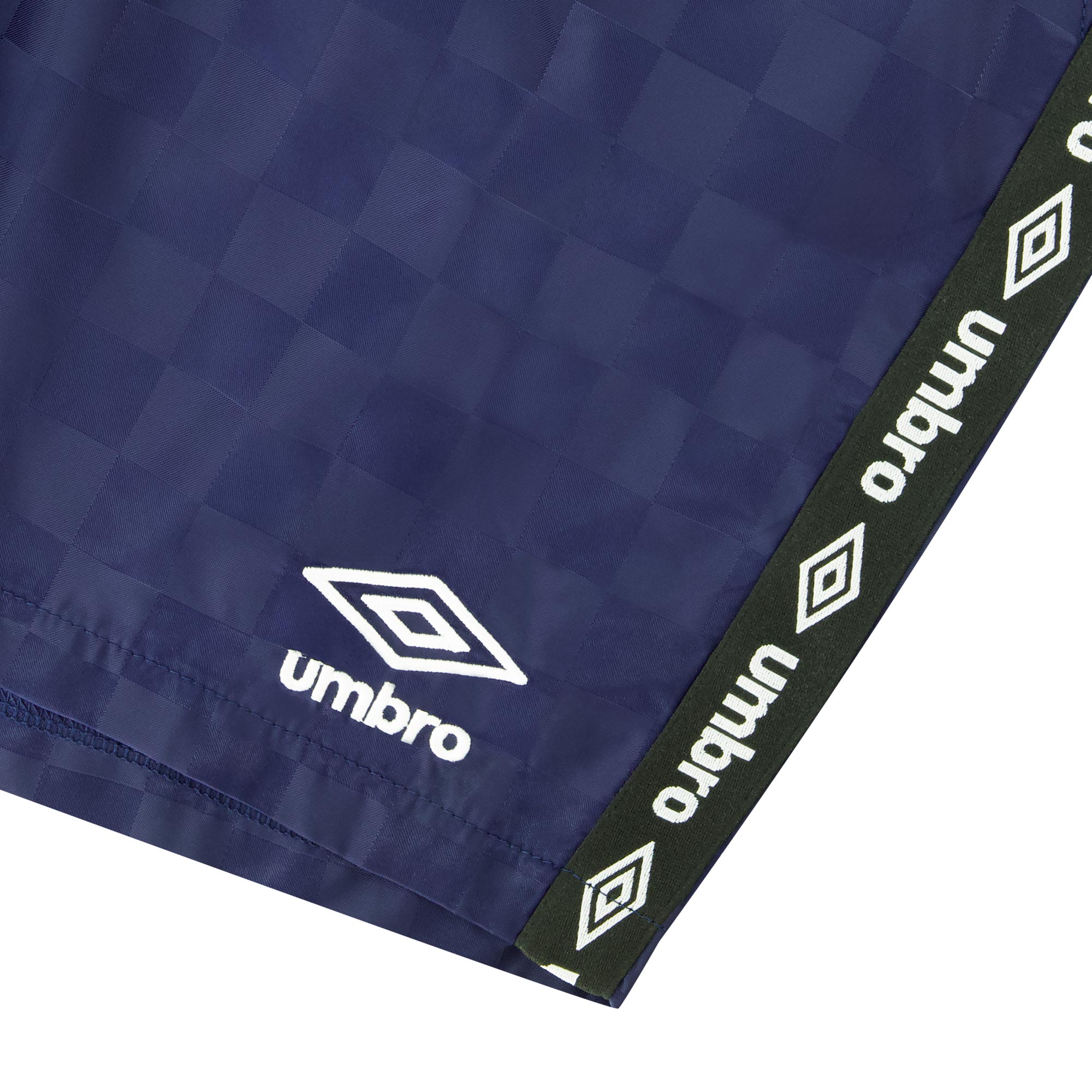 Men's Navy Blue Checkered Logo Short is designed with a logo tape trim along the sides for contrast by Umbro.